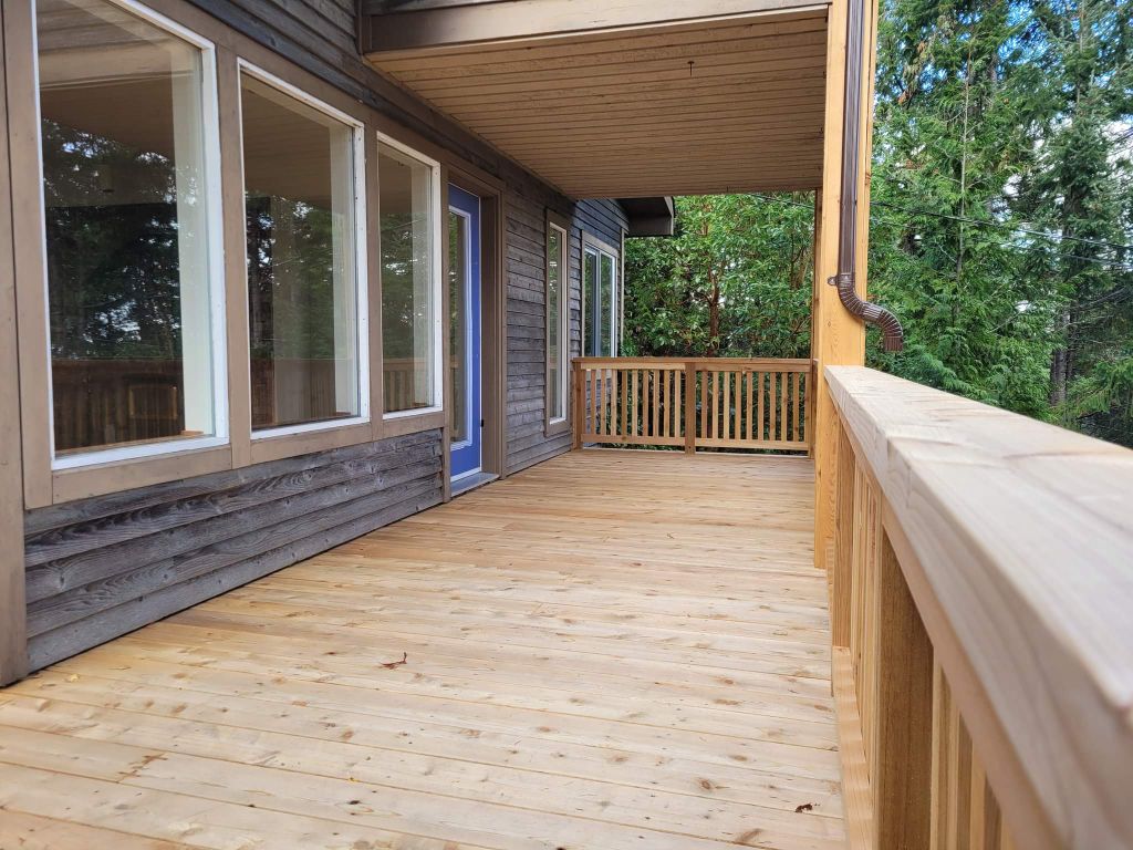 Cedar deck — covered soffit, cedar board railing detail · SSI