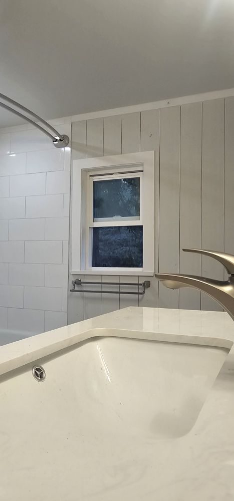 Bathroom renovation — shiplap accent wall, subway tile shower, soaker tub, brushed nickel fixtures