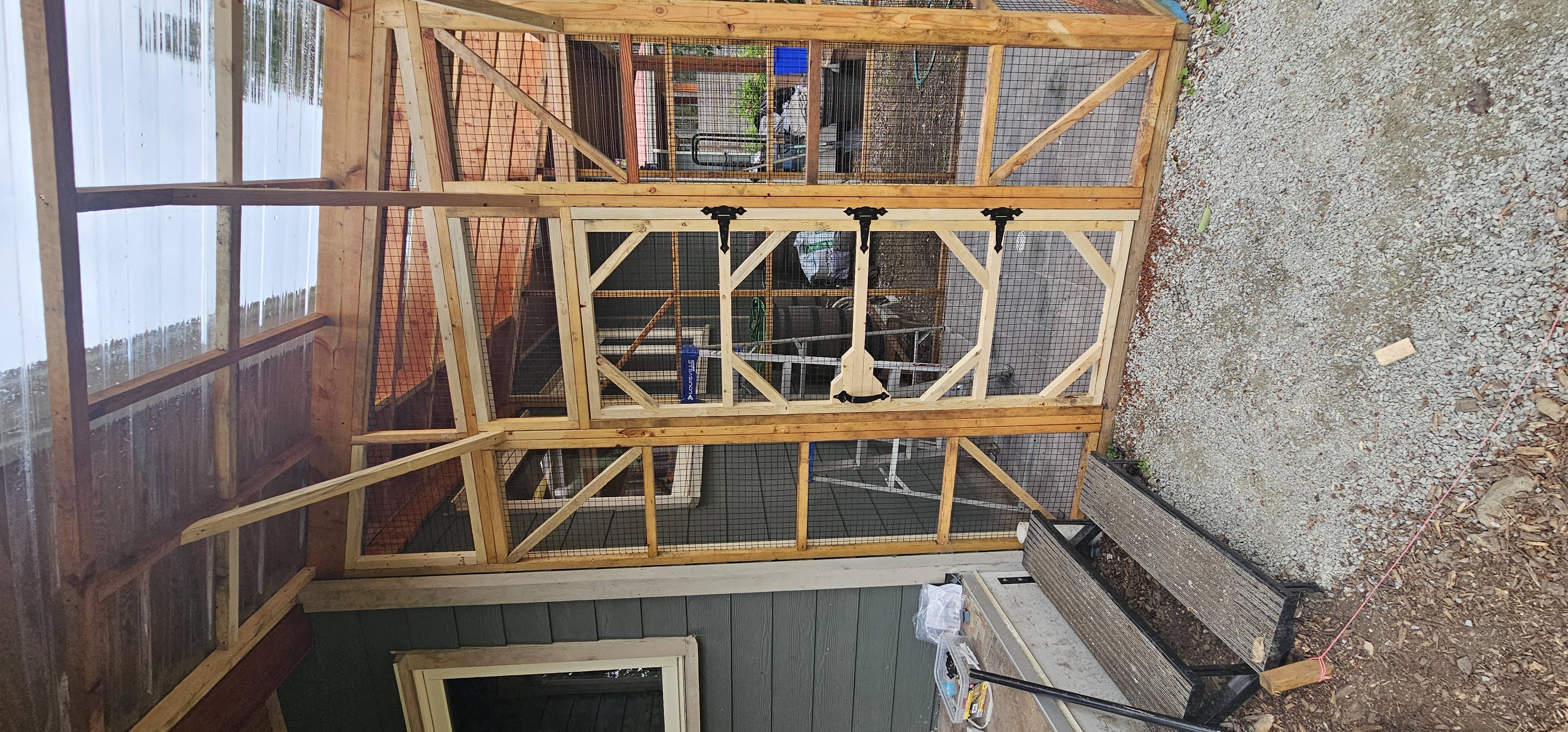 Karen Arnold project — cedar catio door with custom diagonal bracing and screen panels