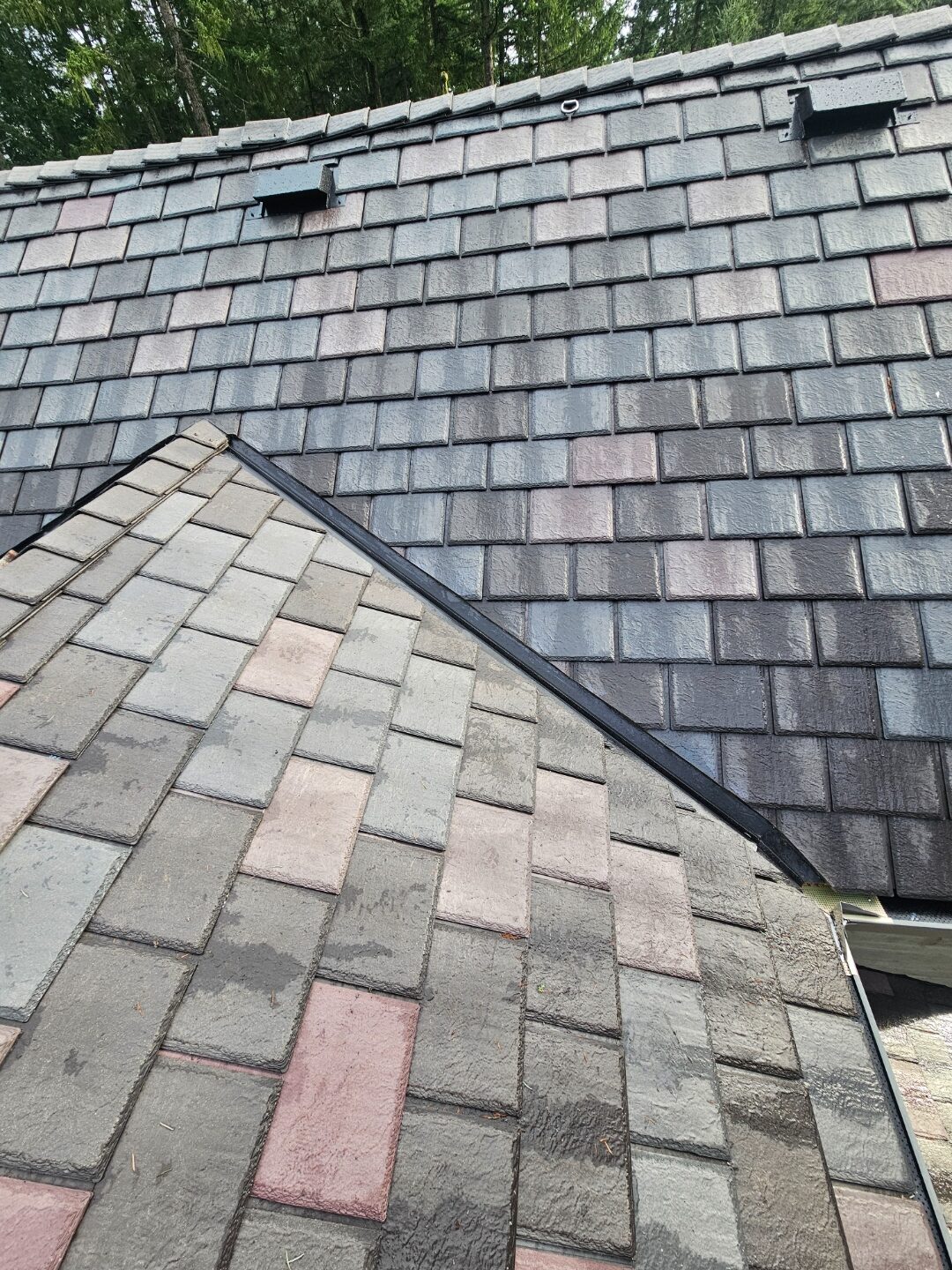 EnviroSlate installation in-progress — synthetic slate tile laying, Enviroshield membrane visible