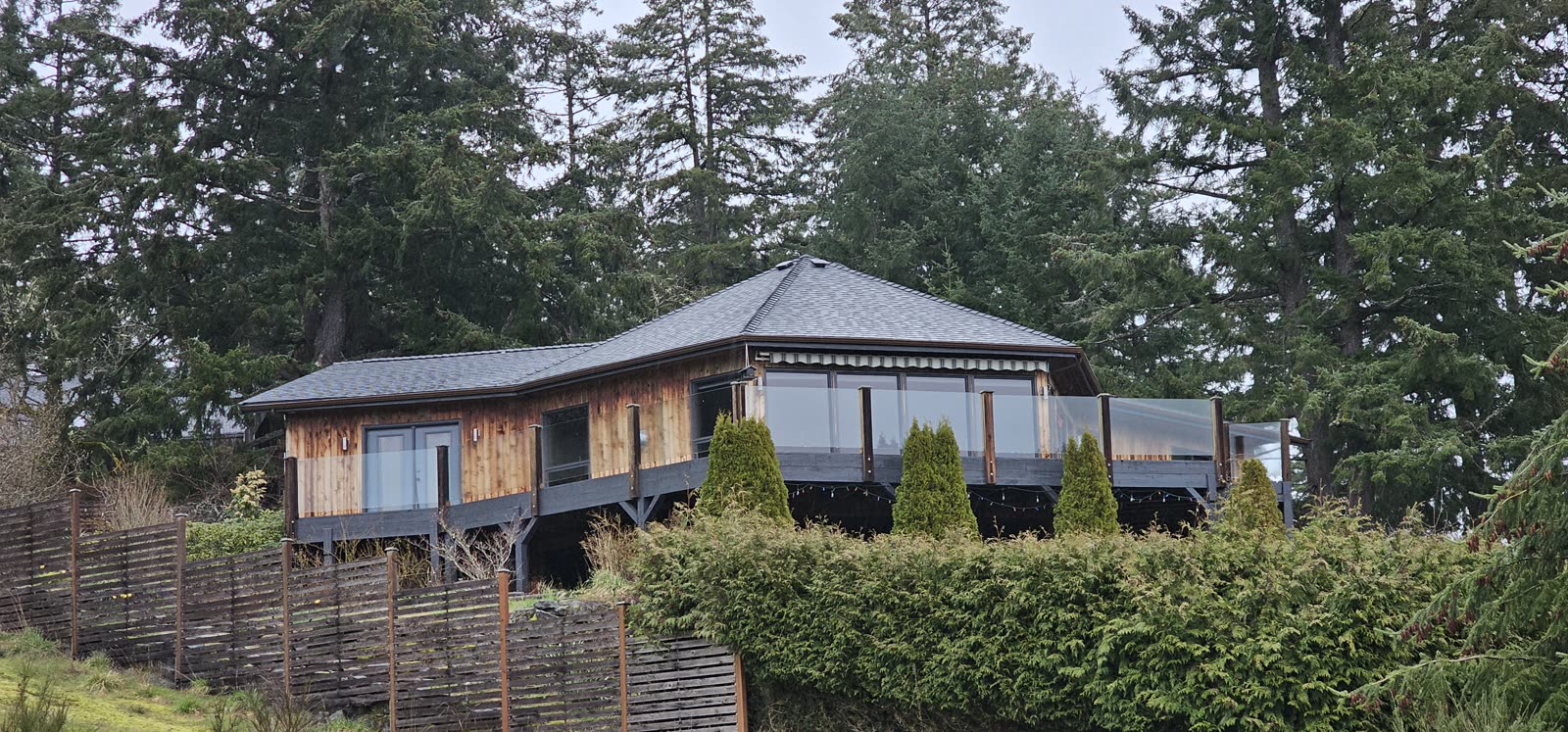 Sandpiper project — completed dark charcoal asphalt shingle reroof, full house exterior
